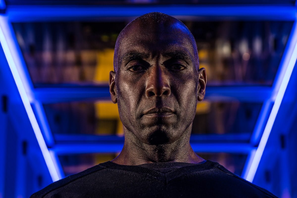 black man photographed in darkened data centre by commercial photographer John Slaytor