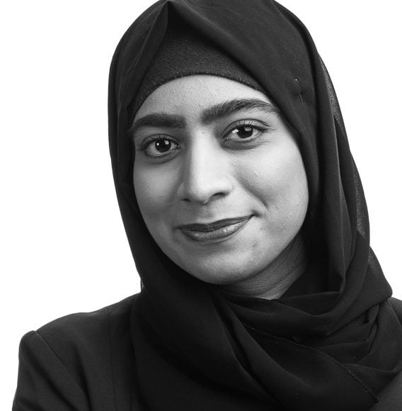 corporate portrait of smiling woman wearing hijab